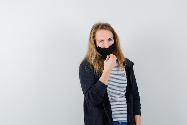 Expressive young woman posing in the studio