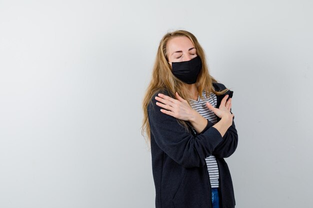 Expressive young woman posing in the studio