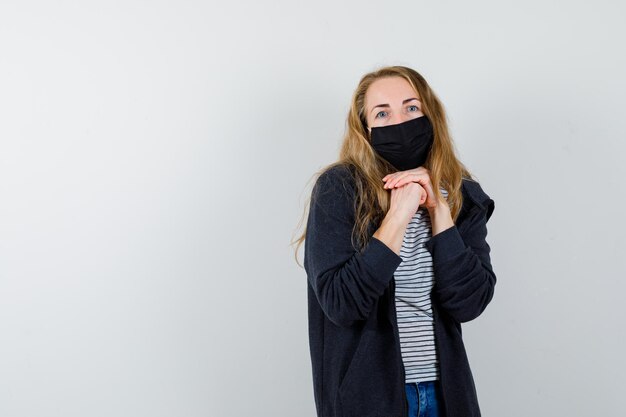 Expressive young woman posing in the studio