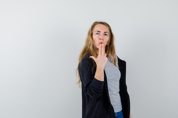 Expressive young woman posing in the studio