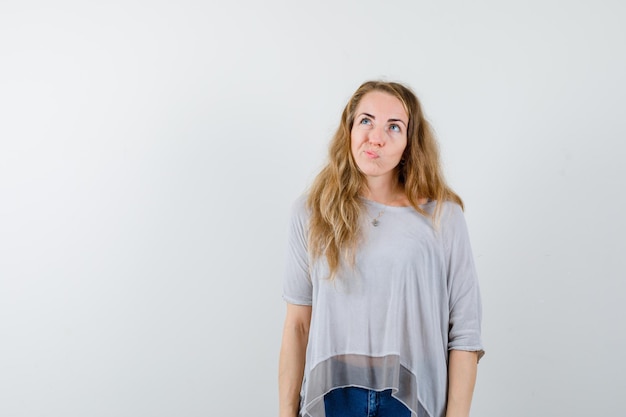 Expressive young woman posing in the studio