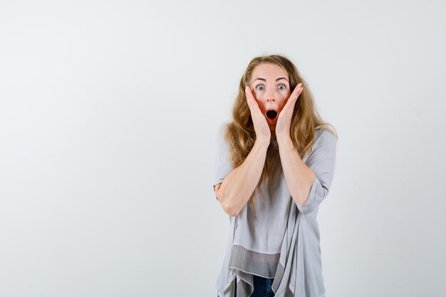 Expressive young woman posing in the studio