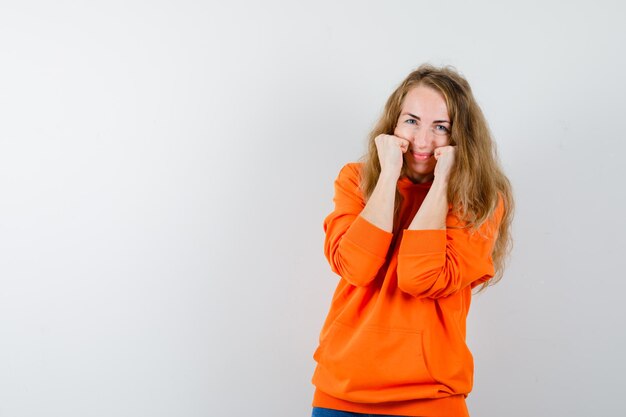 Expressive young woman posing in the studio