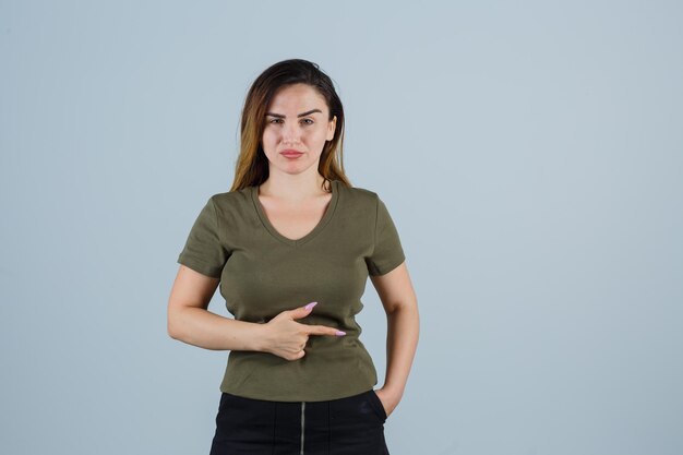 Expressive young woman posing in the studio