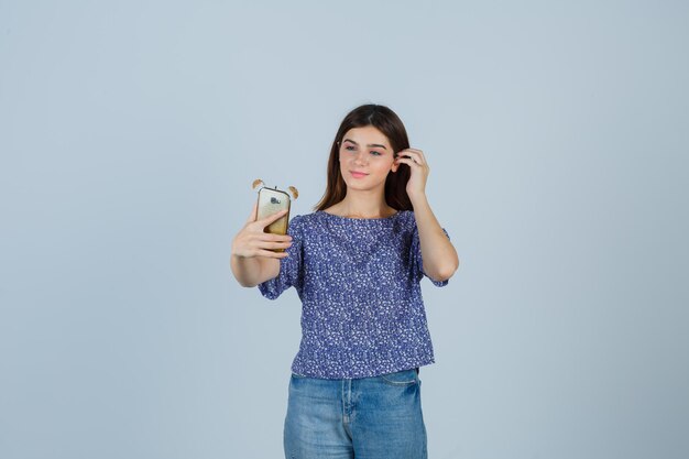 Expressive young woman posing in the studio