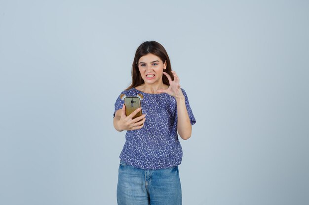 Expressive young woman posing in the studio