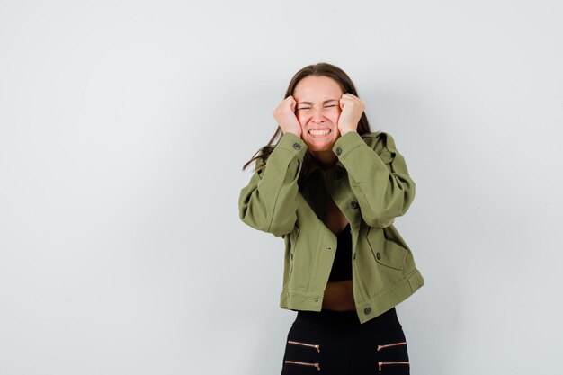 Expressive young woman posing in the studio