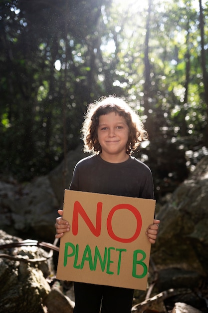 Free photo exterior portrait of kid for world environment day