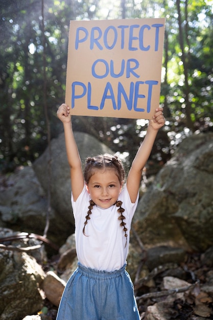 Free photo exterior portrait of kid for world environment day