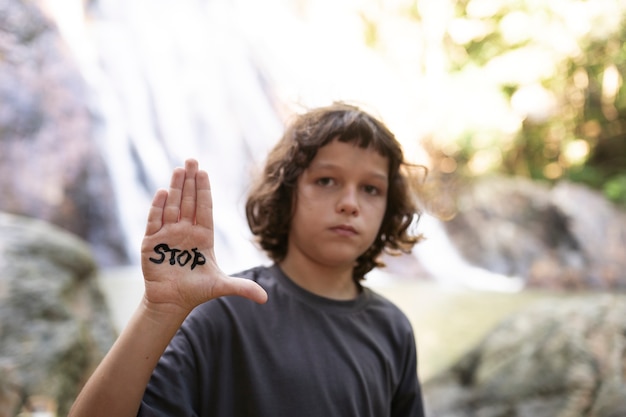 Free photo exterior portrait of kid for world environment day