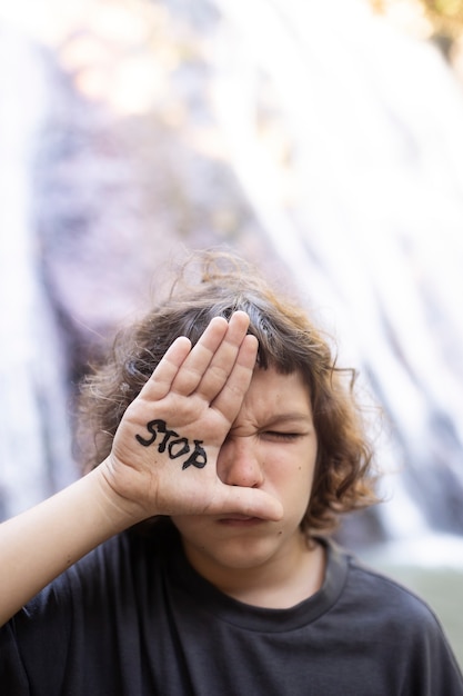 Free photo exterior portrait of kid for world environment day