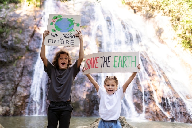 Free photo exterior portrait of kids for world environment day