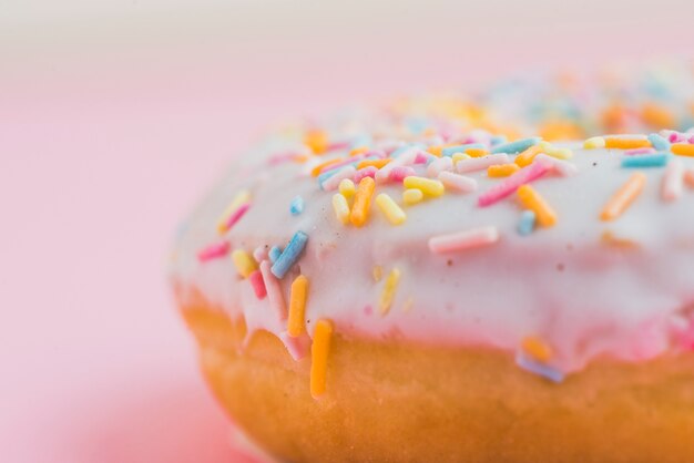 Extreme close-up of fresh donut with sprinkles