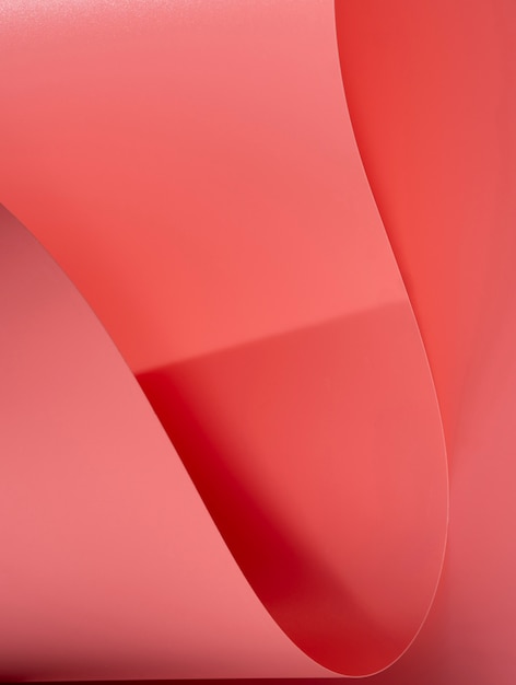 Free photo extreme close-up of pink curved sheets of paper