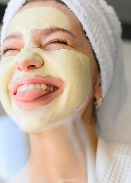 Extremely happy woman with face mask on