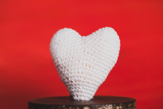 Fabric heart on a red background