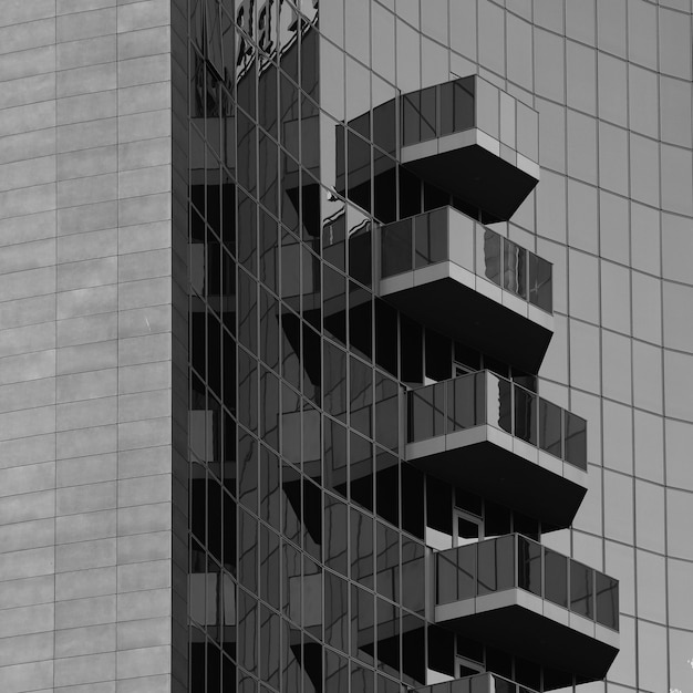 Free Photo facade and balconies of a modern building with glass panels