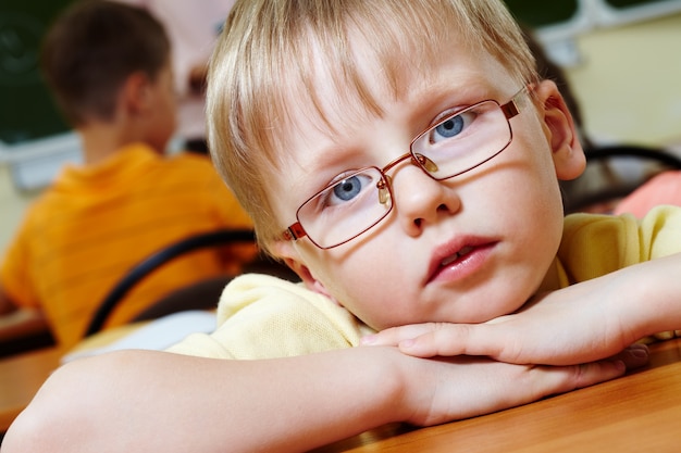 Face close-up of little boy with glasses