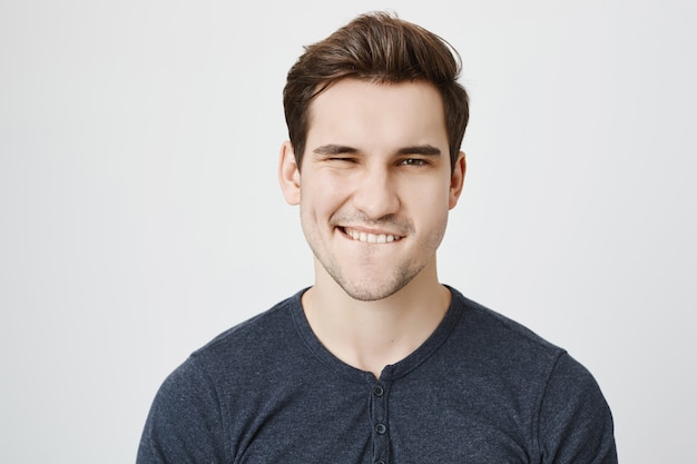 Free photo face of confident and sassy man flirting