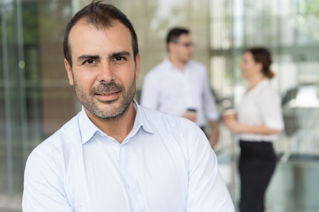 Face of happy male executive looking at camera and smiling