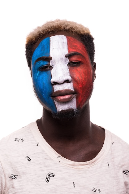 Free photo face portrait of afro fan support france national team with painted face isolated on white background