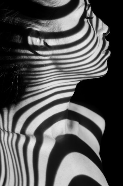 face of woman with black and white zebra stripes