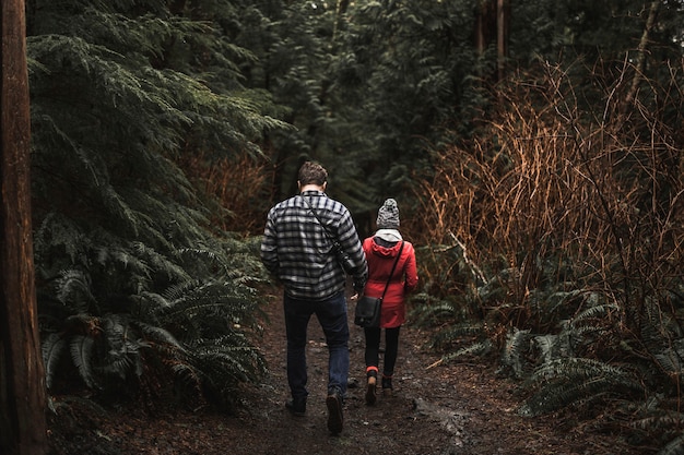 Faceless couple in forest