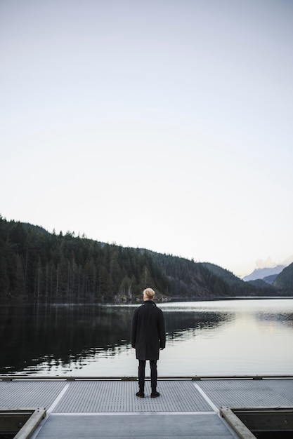 Free Photo faceless man looking at water