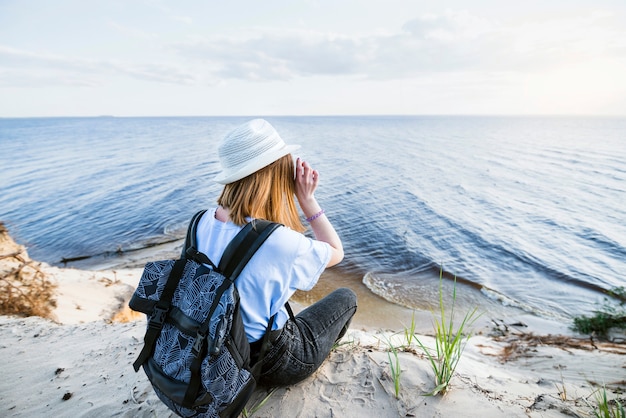 Free Photo faceless woman looking at sea