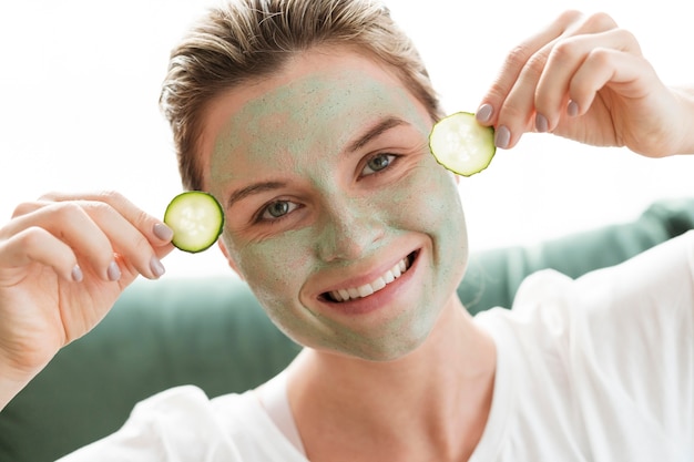 Free photo facial mask and slices of cucumber