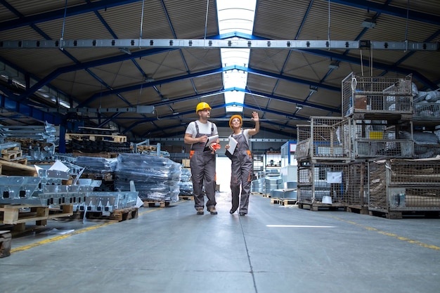 Free Photo factory workers walking through large production hall