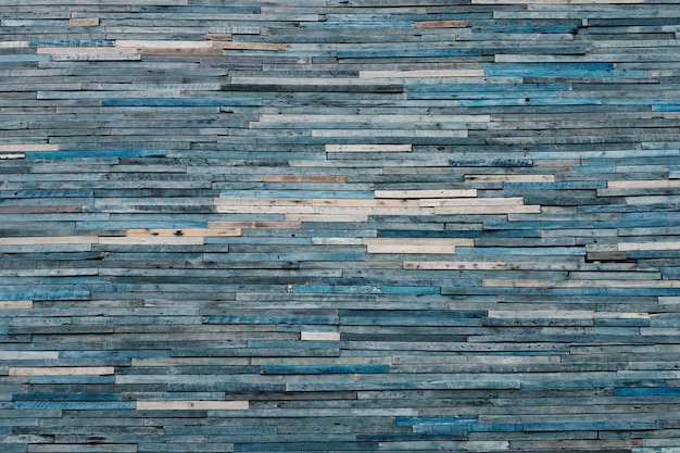 Free Photo faded blue wooden piles textured background