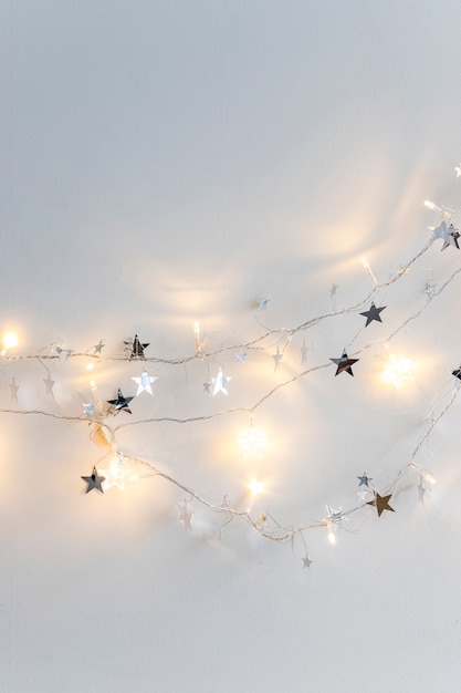 Free photo fairy lights and ornament stars