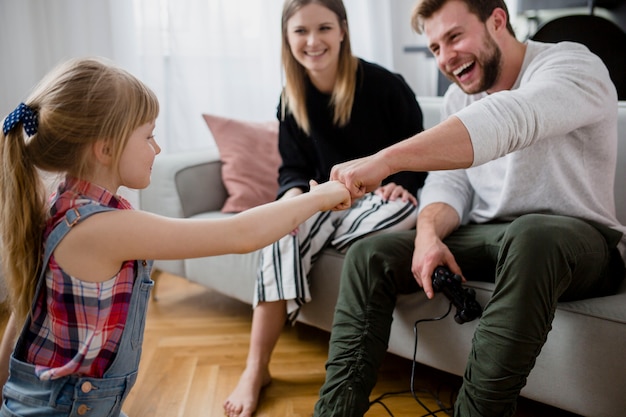 Free photo family bumping fists