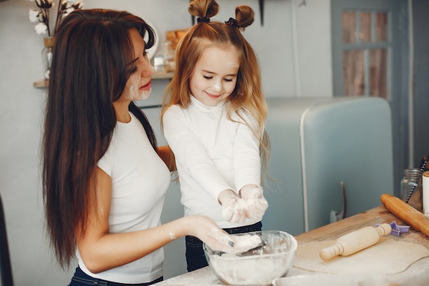 Family cook the dough for cookies