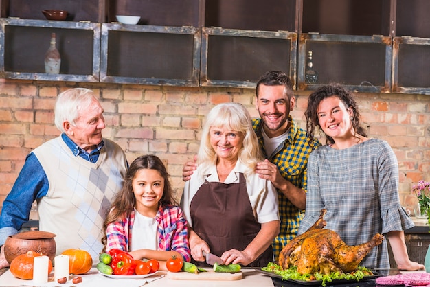 Family cooking turkey in kitchen 