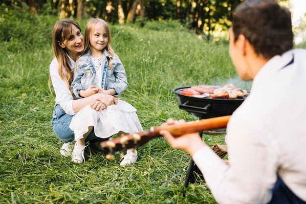 Family doing a barbecue in nature