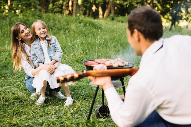 Family doing a barbecue in nature