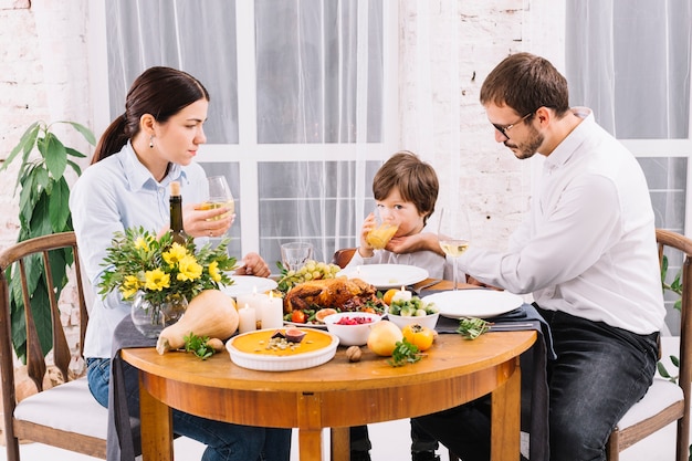 Free Photo family drinking at festive table