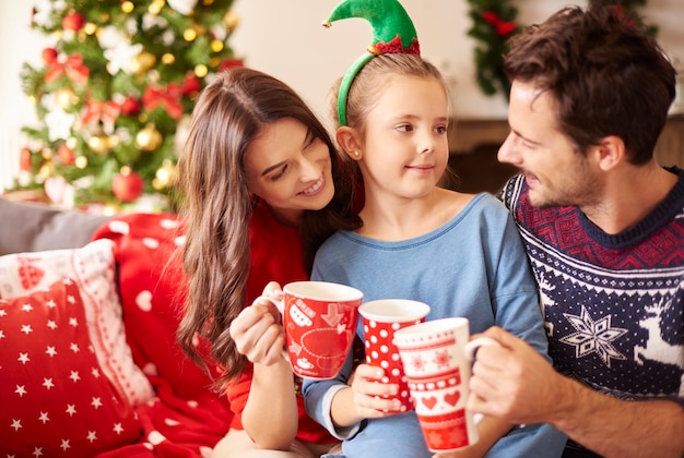 Family drinking hot chocolate at Christmas