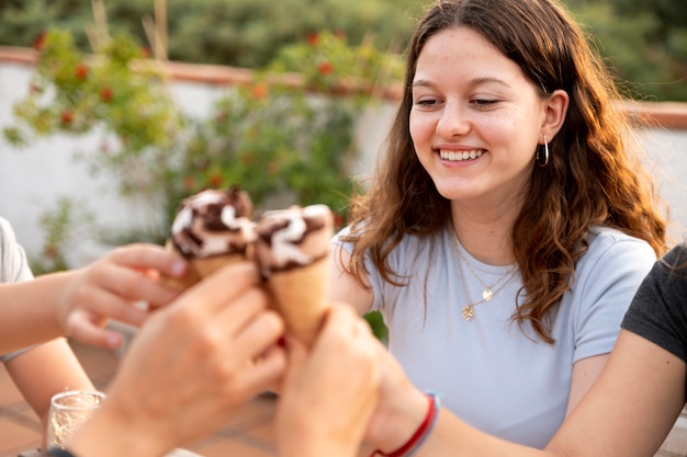 Family enjoying ice cream together outdoors