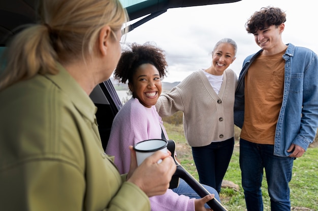 Free photo family enjoying a stop on their road trip