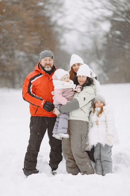 Family on family Christmas vacation. Grandparents with children. People posing on a camera.