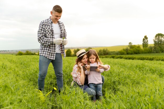 Family at farm with tablet