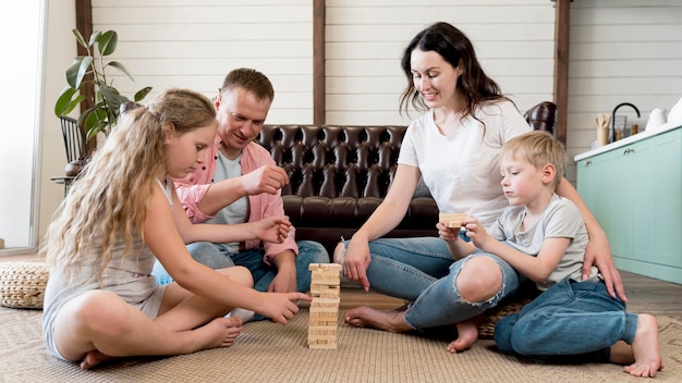 Family on floor playing game