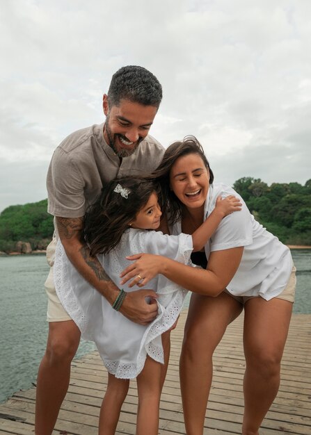 Family hanging out on a jetty