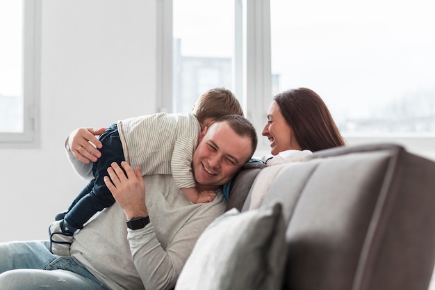 Family having fun on the couch