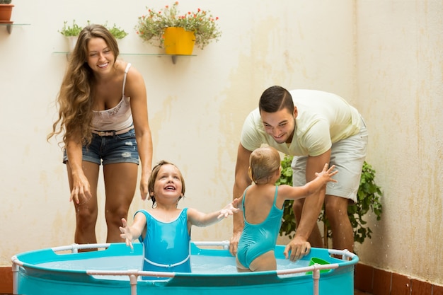 Family having fun in kids pool