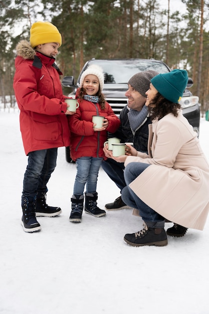 Family having fun during winter roadtrip