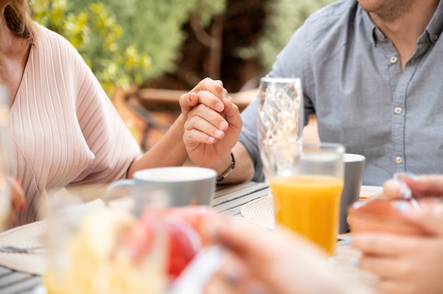 Family having lunch together outdoors